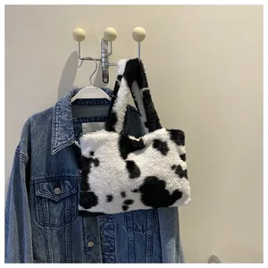 Stylish plush cow print shoulder bag with fuzzy milk pattern texture for women fashion