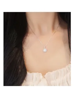 Close-up of moissanite square halo necklace on a model for elegant look.