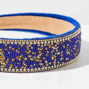 Close-up detail of a blue Baroque headband with intricate beadwork and rhinestones