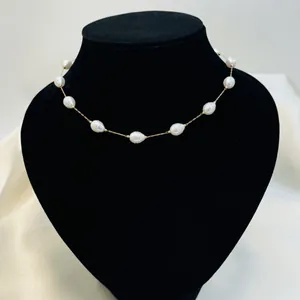 Elegant baroque pearl necklace detailed view on a professional black velvet bust