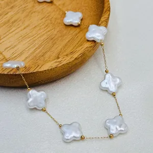 Elegant white shell four-leaf clover charm necklace, gold chain summer beach jewelry.