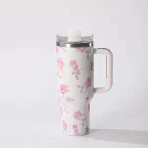 Detail view of 40oz stainless steel tumbler with elegant pink rose floral pattern and handle.