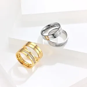 Stainless steel couple rings with cubic zirconia stones in gold and silver finish
