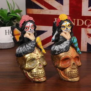 Close-up detail of resin sugar skull figurines with colorful Day of the Dead dolls