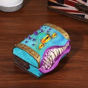 Detailed close-up of a fantasy resin monster mimic treasure chest figurine on wood