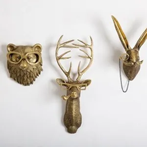 Vintage gold animal head resin figurines including bear, deer, and rabbit with glasses