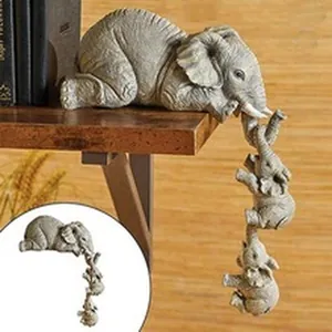 Macro view of elephant family resin figurines decoratively hanging from a shelf