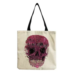 Detail view of the intricate purple skull graphic on a beige canvas tote bag