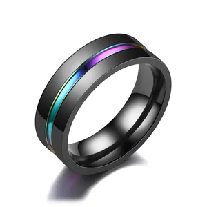 Detail showing the rainbow iridescent stripe on a polished black titanium ring