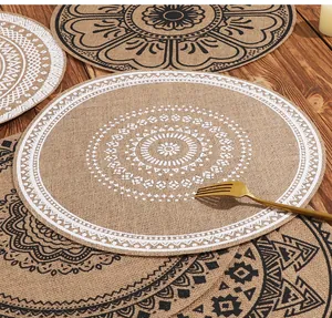 Macro view showing the intricate mandala pattern and woven texture of the jute placemat