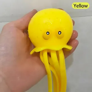 Close-up macro detail of soft yellow octopus squeeze toy for bath and pool play fun