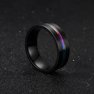 Detailed view of black brushed titanium ring featuring a colorful rainbow groove