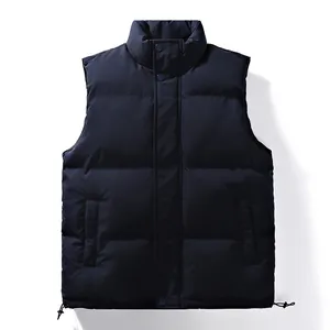 Dark navy blue men's quilted puffer vest jacket with mock neck and drawstring hem