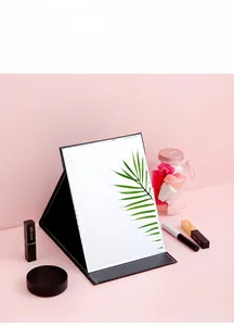 Portable folding makeup mirror with premium black leather cover and polished edges