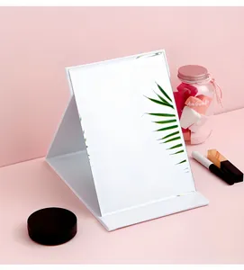 Premium large white leather folding desktop makeup mirror on pink background with props