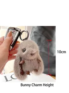 Handmade faux mink fur rabbit keychain shown as a 10cm tall plush bag charm detail