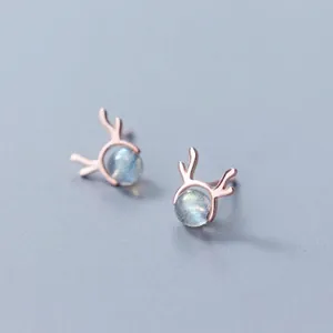 Macro detail of S925 silver reindeer antler stud earrings with blue moonstone beads.
