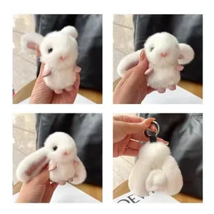 Detailed four-angle collage of a white faux mink fur bunny keychain for handbags