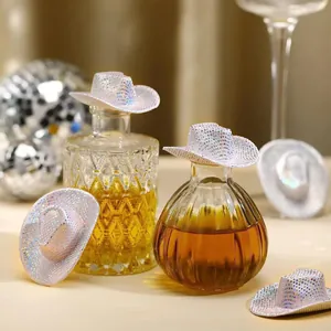 Mini white holographic glitter cowboy hats set on bottles for disco party decorations