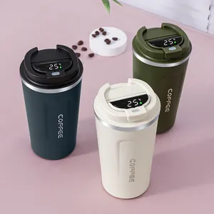Close-up of smart stainless steel coffee tumblers featuring a digital temperature display.