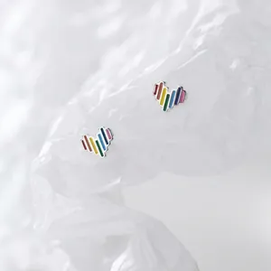 Detailed close-up of S925 silver stud earrings with colorful rainbow heart design