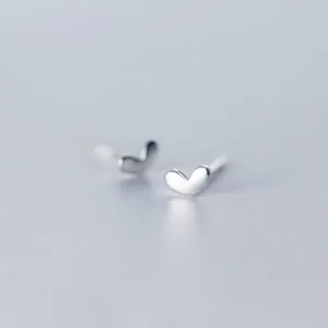 Close-up of minimalist S925 silver heart-shaped stud earrings for women
