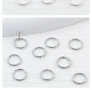 Detailed view of platinum plated twisted jump rings for DIY jewelry making findings