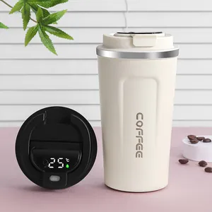 Detail of a cream stainless steel coffee mug with a smart temperature display lid.