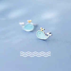Close-up detail of cute light blue whale stud earrings made of S925 silver