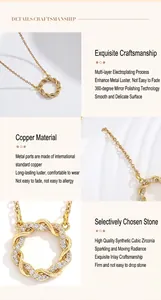 Macro view of a gold-plated Mobius ring necklace with shimmering cubic zirconia stones