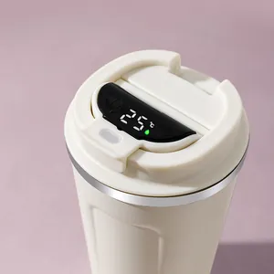 Close-up of smart coffee cup lid featuring a real-time digital LED temperature display.