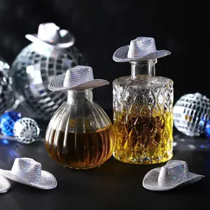 Mini holographic cowboy hats used as sparkling silver disco party bottle toppers decoration