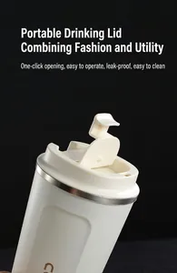 Detail of the easy-open leak-proof lid on a white stainless steel coffee tumbler