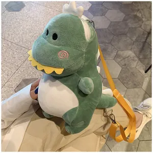 Detail of a green plush dinosaur crossbody bag with a yellow strap for kids and adults.