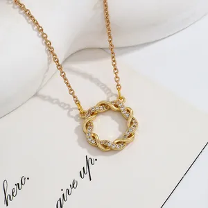 Elegant gold Mobius ring necklace with shimmering cubic zirconia accents for women