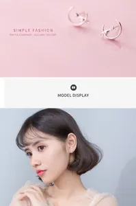 S925 silver crescent moon and cute cat stud earrings on an Asian model