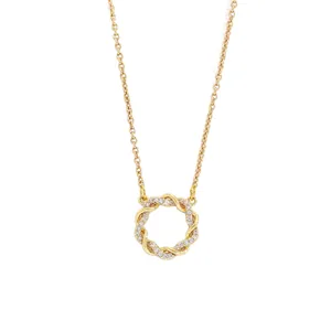 Elegant gold Mobius ring necklace with shimmering zircon stones on white background