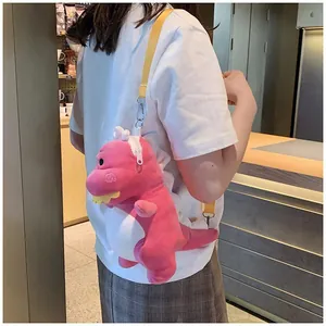 Cute pink plush dinosaur shoulder bag for women worn as a crossbody purse detail.