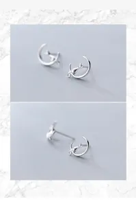 Detailed macro view of S925 silver stud earrings with cute cat on crescent moon design
