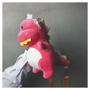 Side view of a cute pink and white dinosaur plush crossbody bag with yellow straps