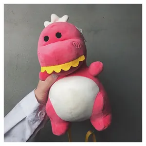 Close-up of a cute pink plush dinosaur crossbody bag showing soft texture and detail.