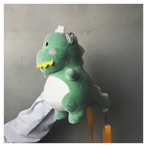Adorable green plush dinosaur crossbody bag with soft texture and vibrant yellow strap.