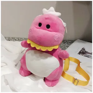 Adorable pink plush dinosaur crossbody bag with an adjustable yellow shoulder strap