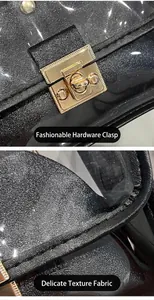 Primo piano della chiusura in metallo dorato e del materiale testurizzato della borsa.