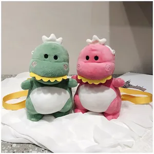 Pair of cute plush dinosaur crossbody bags in soft green and pink fabric for kids