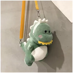 Detailed side view of a cute green plush dinosaur shoulder bag with yellow strap