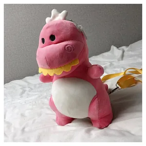 Adorable pink plush dinosaur crossbody bag for children featuring a yellow adjustable strap