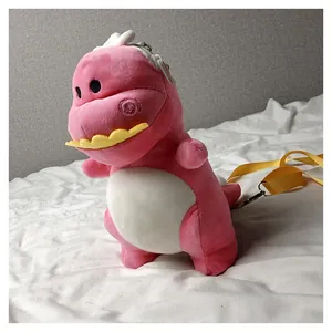 Close-up side view of a cute pink plush dinosaur crossbody bag with yellow strap.