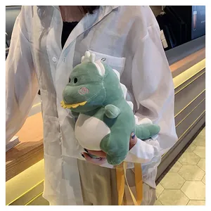 Close-up view of a cute green plush dinosaur crossbody bag featuring white spikes and yellow straps