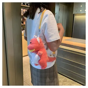 Detailed back view of a woman wearing a cute coral pink plush dinosaur crossbody bag